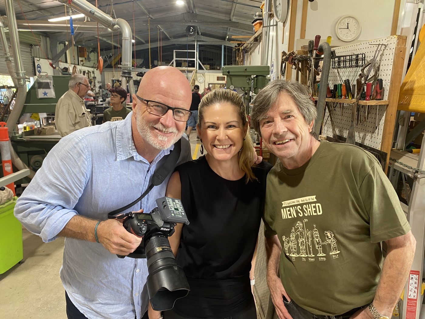 Melissa with a photographer and a member of the Men's Shed