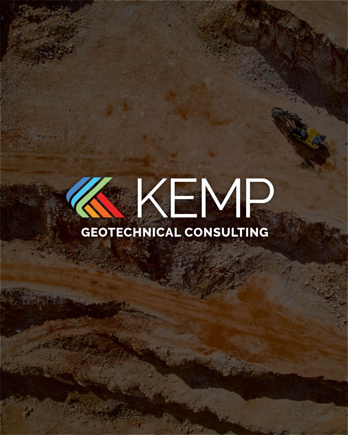 Kemp Geotechnical Consulting logo on an aerial photo of a drilling rig